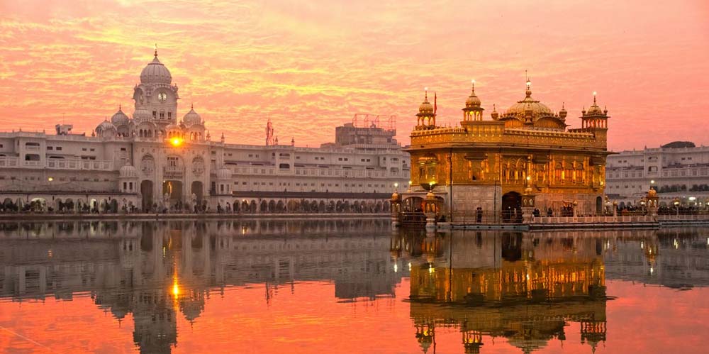 Golden Temple Amritsar at sunset with reflection in holy sarovar